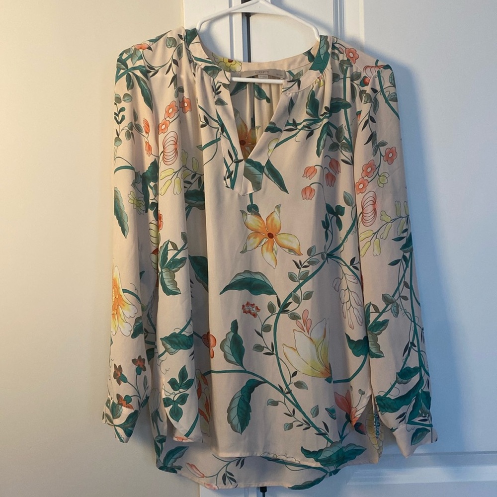 Long sleeve floral blouse.